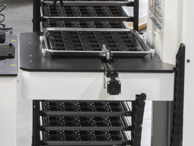 Shelf adjusts vertically to accommodate the Cobot